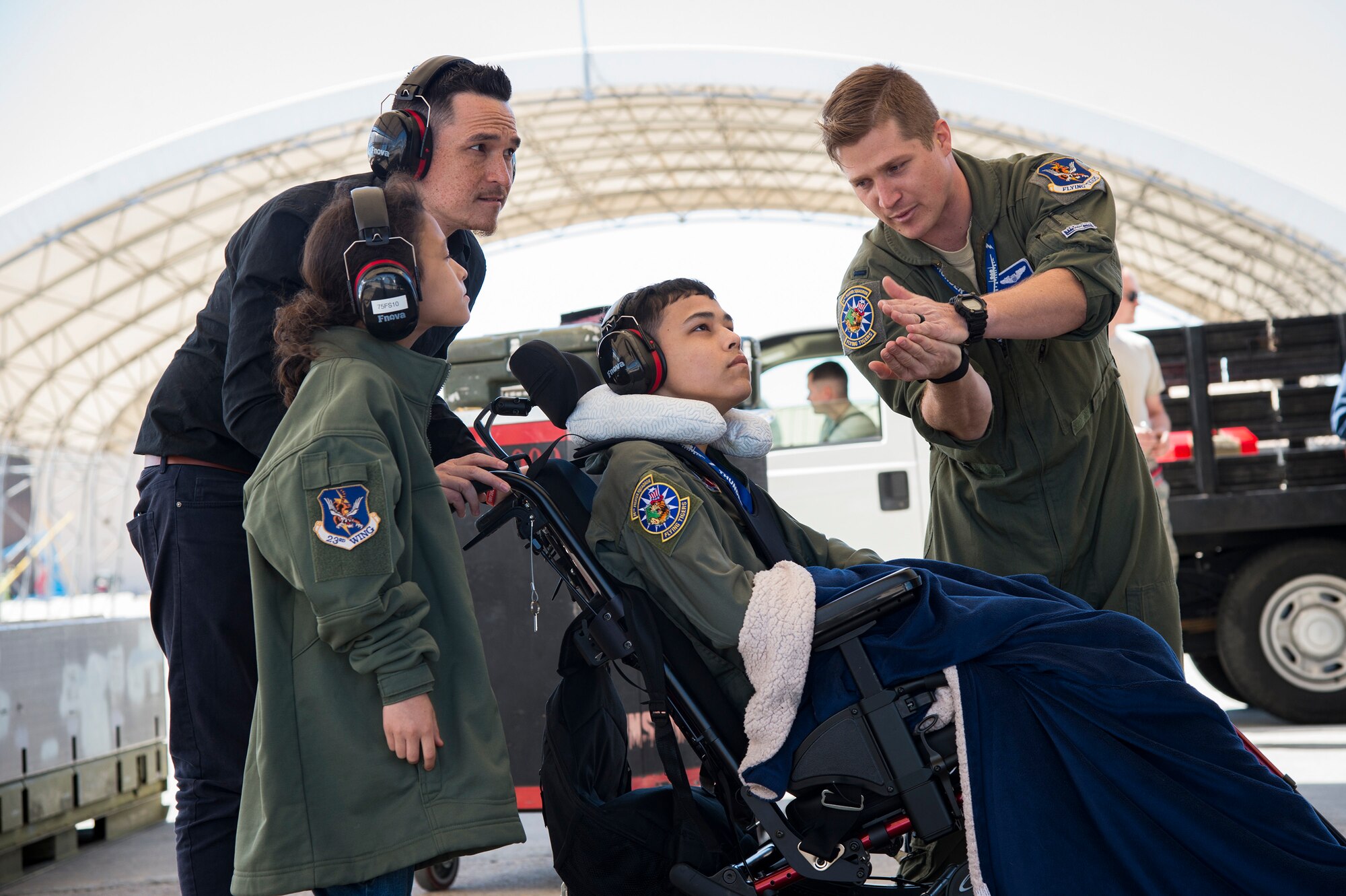 1st Lt. Shaun Dickinson, 74th Fighter Squadron A-10C Thunderbolt II pilot, explains the aerodynamics of an A-10 to 15-year-old Jarod Story on the flightline, March 14, 2018, at Moody Air Force Base, Ga. Pilots from the 23d Fighter Group made Storey, who is terminally ill with Osteosarcoma, a rare form of bone cancer, an honorary A-10 pilot for a day. (U.S. Air Force photo by Andrea Jenkins)