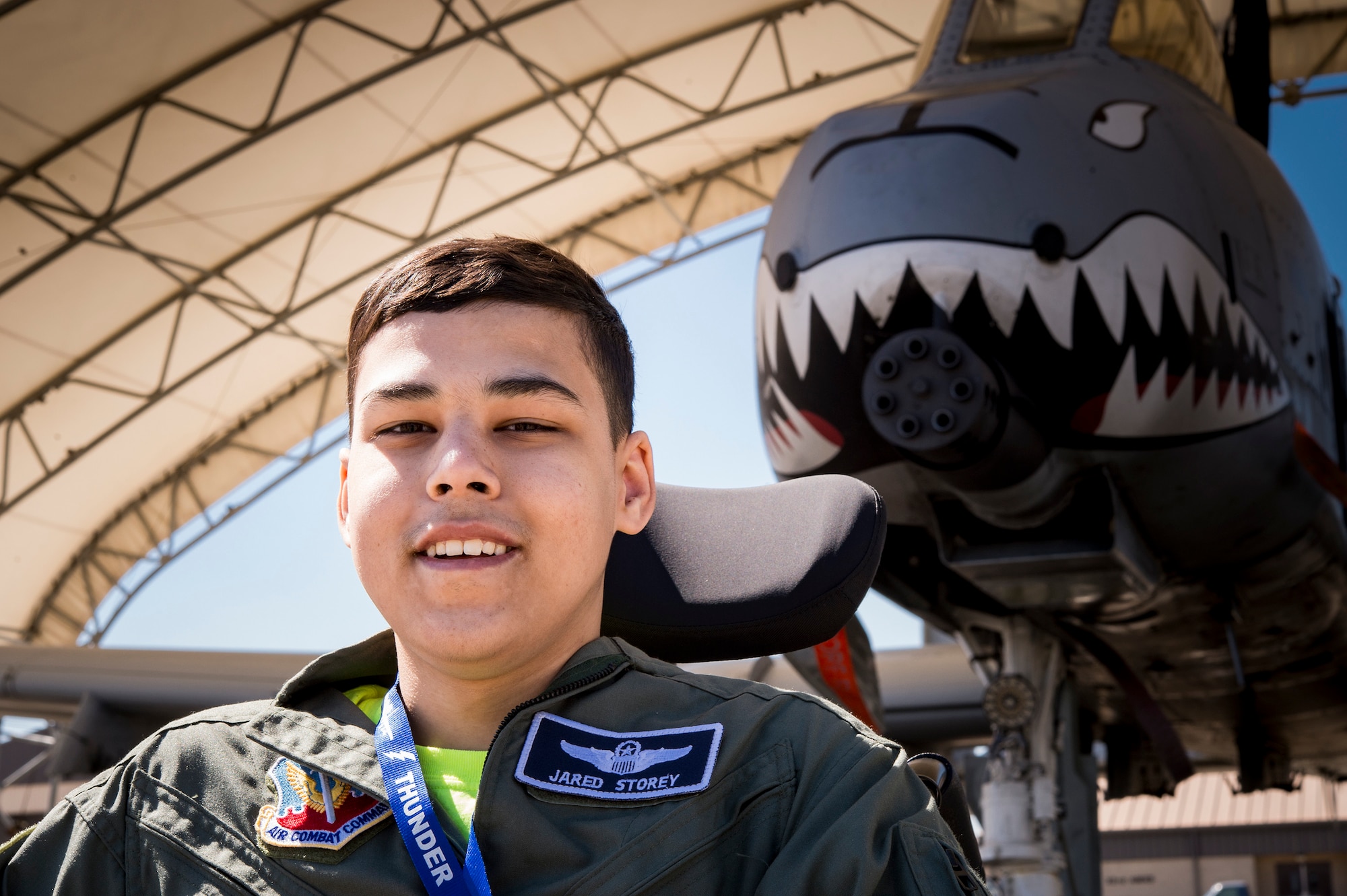 Jared Storey poses for a photo in front of an A-10C Thunderbolt II on the flightline, March 14, 2018, at Moody Air Force Base, Ga. Pilots from the 23d Fighter Group made Storey, who is terminally ill with Osteosarcoma, a rare form of bone cancer, an honorary A-10 pilot for a day. (U.S. Air Force photo by Andrea Jenkins)