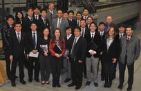 IMAGE: DAHLGREN, Va. - Twenty members of the Japanese Ministry of Defense and Self-Defense Forces delegation representing Japan's Ground, Maritime and Air Self-Defense Forces (GSDF, MSDF, and ASDF) are pictured with three representatives of the U.S. Center for Strategic and International Studies and two Naval Surface Warfare Center Dahlgren Division (NSWCDD) leaders - Chester Petry, electromagnetic railgun lead systems engineer, and Jed Ryan, International Partnering Office lead - in front of the electromagnetic railgun prototype launcher. Navy scientists and engineers briefed the Japanese delegation on NSWCDD mission and capabilities, focusing on directed energy weapons, electromagnetic railgun, hypervelocity projectile, and human systems integration programs. The February visit is the latest in a series of annual visits supporting the U.S. Center for Strategic and International Studies and Japan's Ministry of Defense Executive Training Program. The Japanese Ministry of Defense and Self-Defense Forces carry out various activities seamlessly and flexibly based on joint operations of GSDF, MSDF, and ASDF.  (U.S. Navy photo/Released)