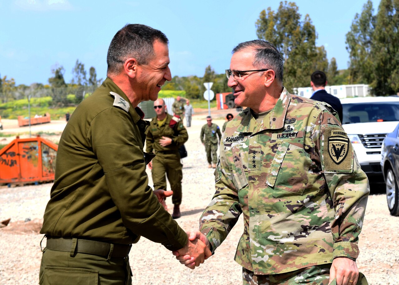 Army Gen. Curtis M. Scaparrotti, commander of U.S. European Command and NATO’s supreme allied commander for Europe, shakes hands with deputy chief of the Israeli General Staff Maj. Gen. Aviv Kochavi at Hatzor Air Force Base, Israel.