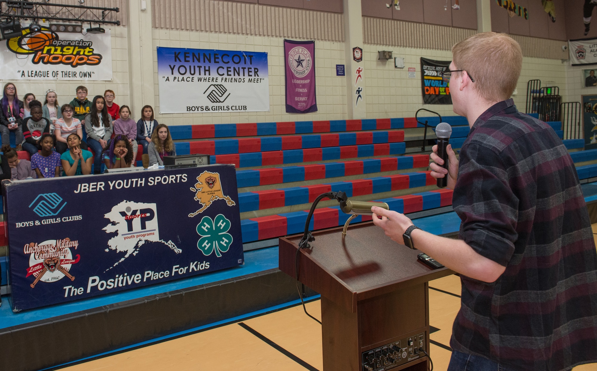 Jon Peterson speaks to children about the power of education at the Kennecott Youth Center at Joint Base Elmendorf-Richardson, Alaska, March 7, 2018. Jon was recognized as this year’s Boys and Girls Clubs of America Military Youth of the Year for the state of Alaska and awarded a $5,000 scholarship. The program is designed to promote service to club, community and family, academic success, strong moral character, life goals and poise and public speaking. Jon will now compete at the Pacific Air Forces regional level for a chance to win a $40,000 scholarship and an invitation to compete at the national level.
