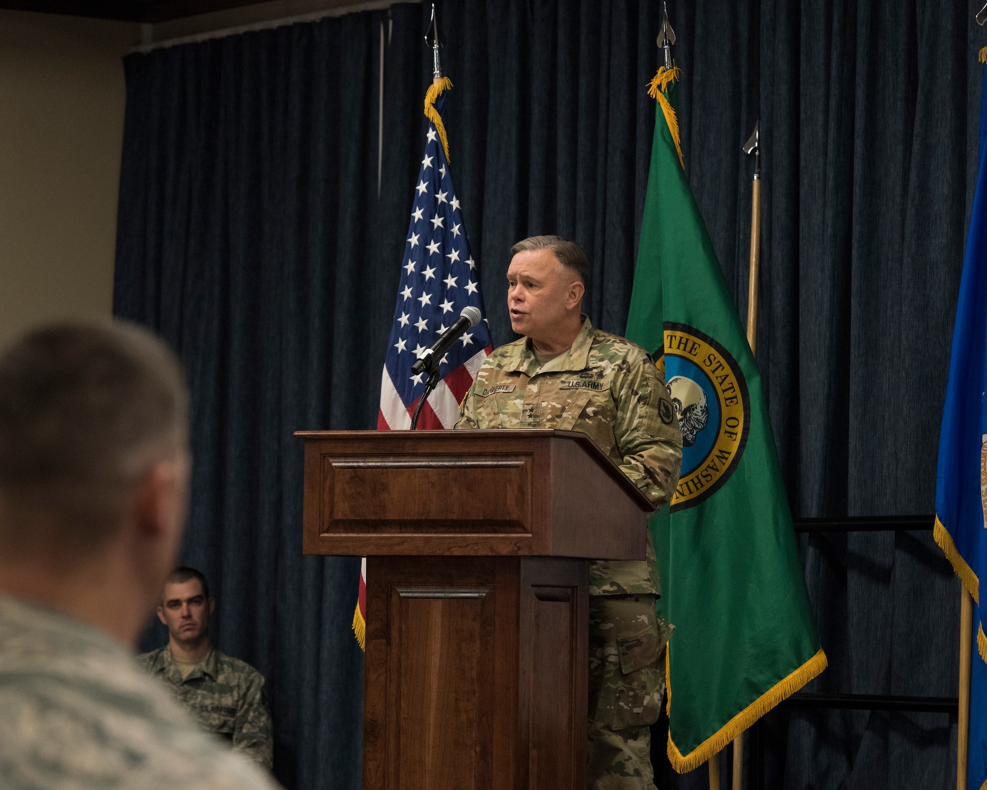 Maj. Gen. Bret Daugherty, Adjutant General, Washington, addresses friends, families, and Guardsmen from the 242nd Combat Communications Squadron at a ceremony to welcome more than 30 Airmen home from a recent six-month deployment in Southwest Asia in support of Operation Inherent Resolve March 3, 2018 at Fairchild Air Force Base, Wash. The recent deployment was the largest single deployment in the 65-year history of the squadron. (U.S. Air National Guard photo by Staff Sgt. Rose Lust)