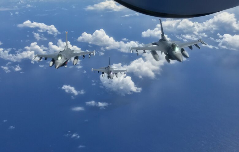 The 14th Fighter Squadron conducts refueling operations over the Pacific Ocean.