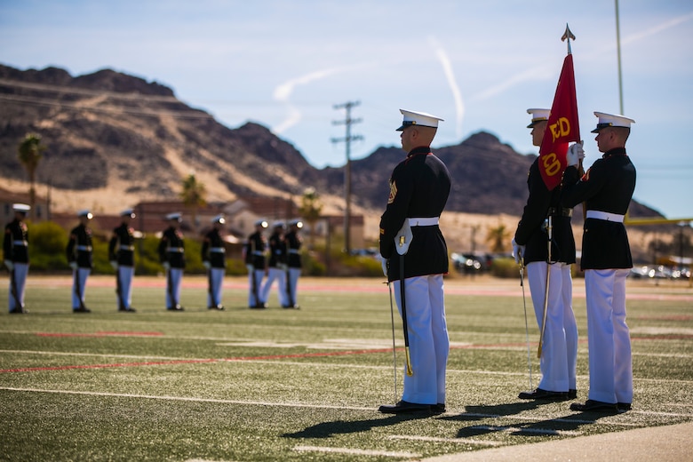 The U.S Marine Corps Silent Drill Platoon, Battle Colors Detachment, Marine Barracks Washington, D.C., performs during the Battle Colors Ceremony at Felix Field aboard the Marine Corps Air Ground Combat Center, Twentynine Palms, Calif., March 14, 2018. The ceremony is held to honor Marine Corps traditions through the Drum Corps, the Silent Drill Platoon and the Battle Colors Detachment.