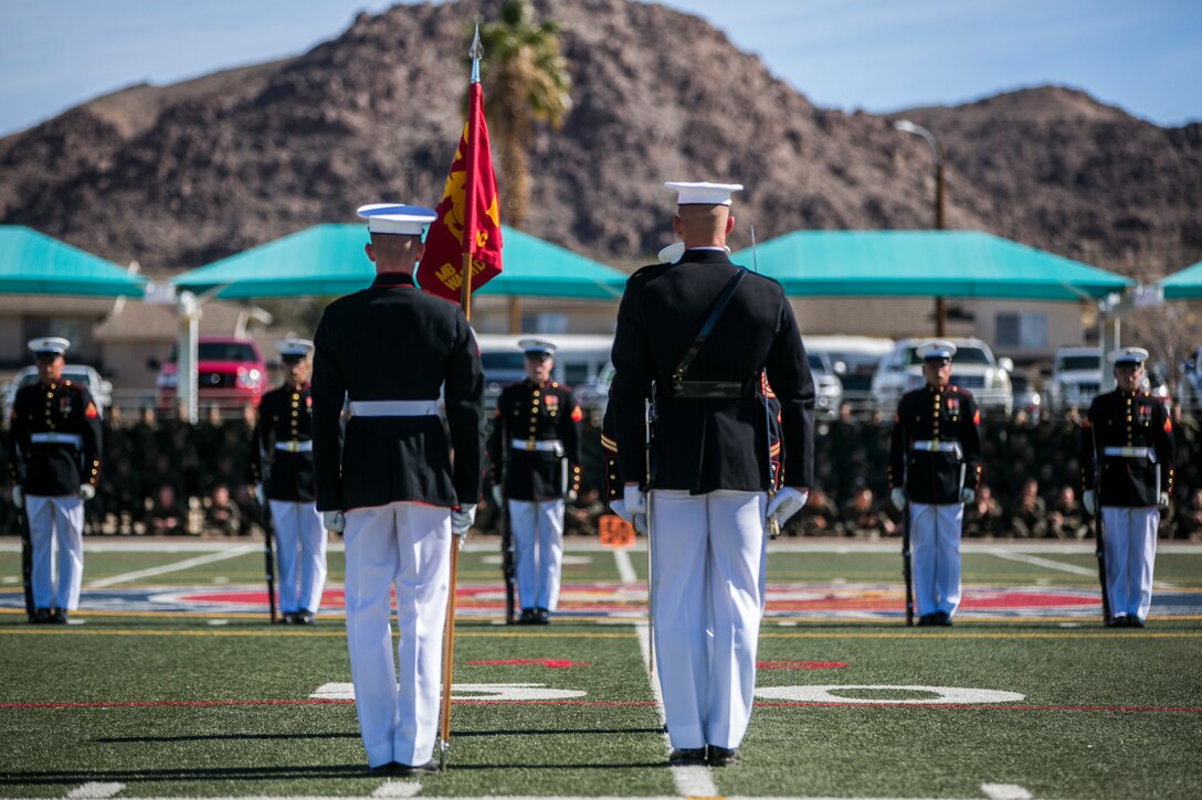 The U.S Marine Corps Silent Drill Platoon, Battle Colors Detachment, Marine Barracks Washington, D.C., performs during the Battle Colors Ceremony at Felix Field aboard the Marine Corps Air Ground Combat Center, Twentynine Palms, Calif., March 14, 2018. The ceremony is held to honor Marine Corps traditions through the Drum Corps, the Silent Drill Platoon and the Battle Colors Detachment.