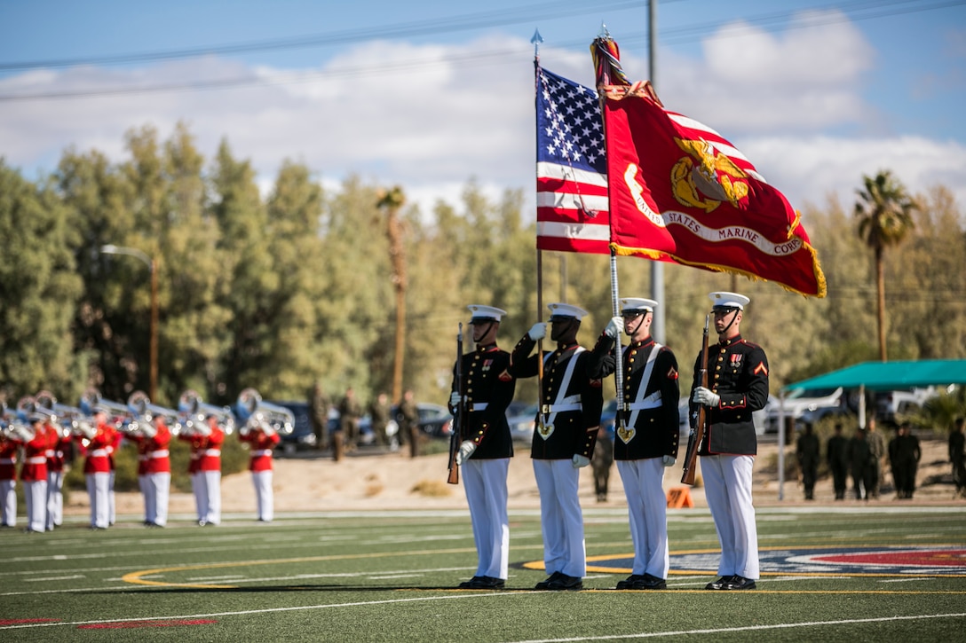 The U.S. Marine Corps Commandant’s Four, Battle Colors Detachment, Marine Barracks Washington, D.C., present the colors during a Battle Colors Ceremony at Felix Field aboard the Marine Corps Air Ground Combat Center, Twentynine Palms, Calif., March 14, 2018.  The ceremony is held to honor Marine Corps traditions through the Drum Corps, the Silent Drill Platoon and the Battle Colors Detachment.