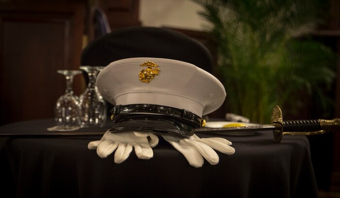 A fallen comrades table sits in the far corner of the room during 3rd Battalion, 12th Marine Regiment St. Barbara’s Day celebration, March 9, 2017. This table is used to represent and remind service members and their families of sacrifices that have been made. St. Barbara’s Day is celebrated by artillery Marines to recognize those who have given a lifetime of servitude to the artillery community.