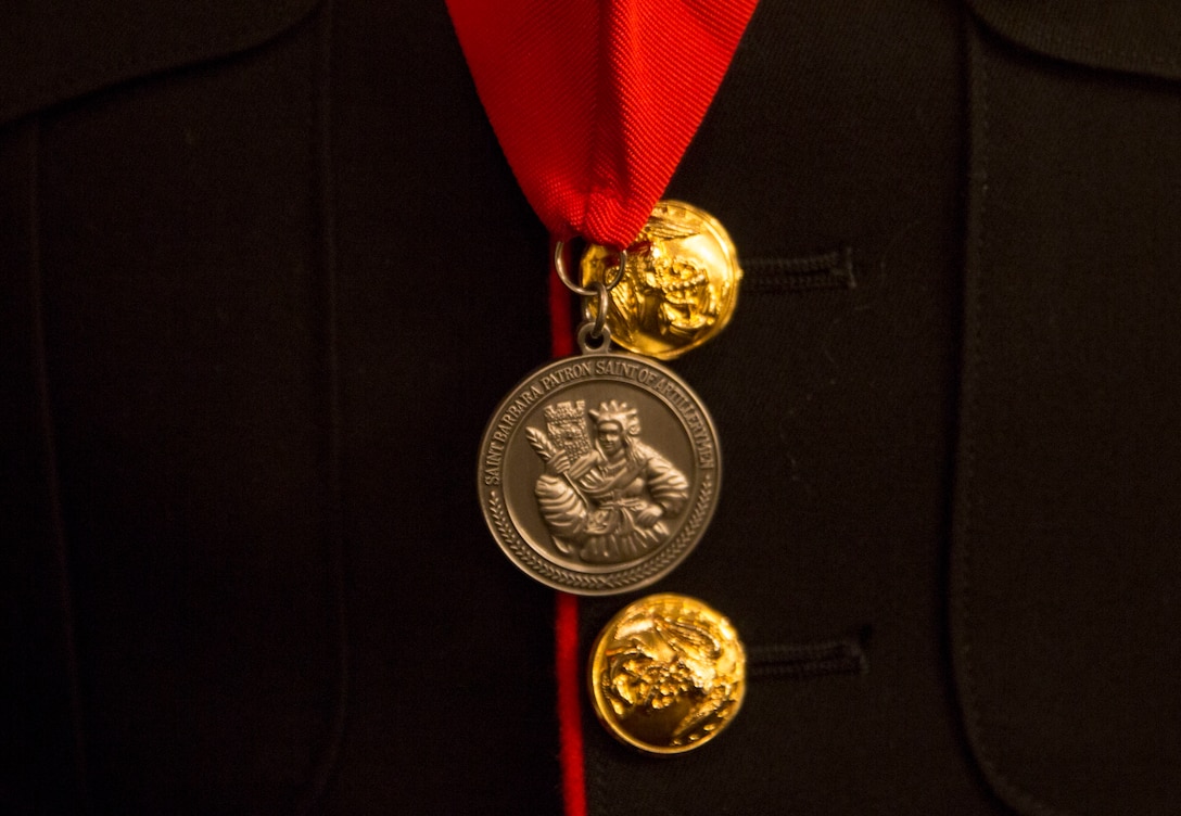 Master Gunnery Sgt. Lamar Burris displays his St. Barbara’s Medallion during a St. Barbara’s Day celebration, March 9, 2017. The Honorable Order of St. Barbara recognizes Marines for their accomplishments in the artillery occupation. Burris, a native of Gastonia, North Carolina, is with 3rd Battalion, 12th Marine Regiment, 3rd Marine Division.