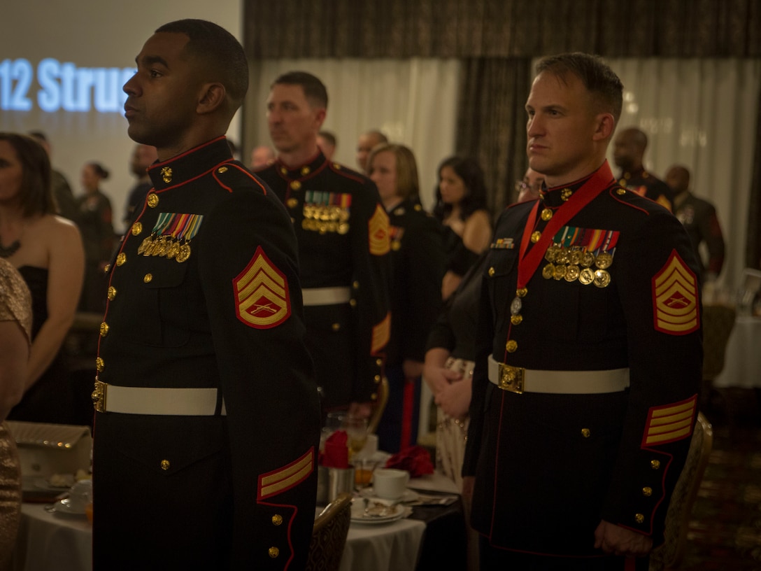 Artillery Marines stands at attention for the Marine Corps Hymn during 3rd Battalion, 12th Marine Regiment’s St. Barbara’s Day celebration, March 9, 2017. St. Barbara’s Day is celebrated by artillery Marines to recognize those who have given a lifetime of servitude to the artillery community.