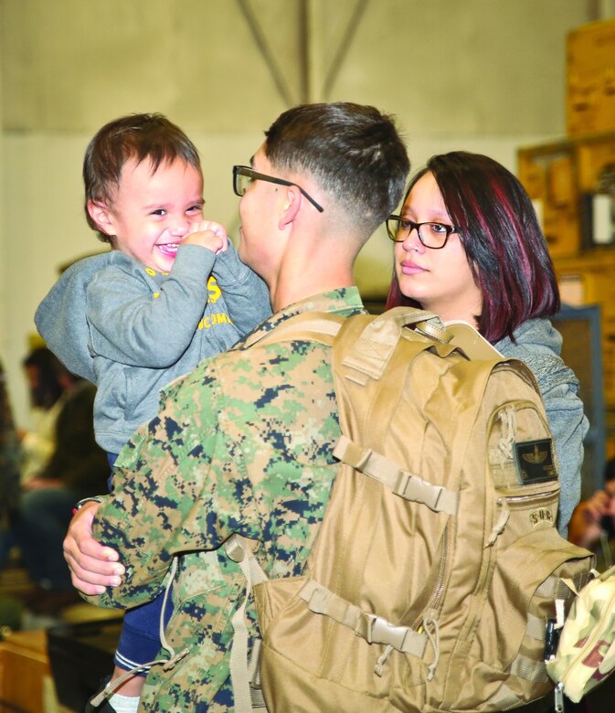 A Marine spends time with his family before leaving for a deployment aboard Marine Corps Air Station Beaufort, March 13.