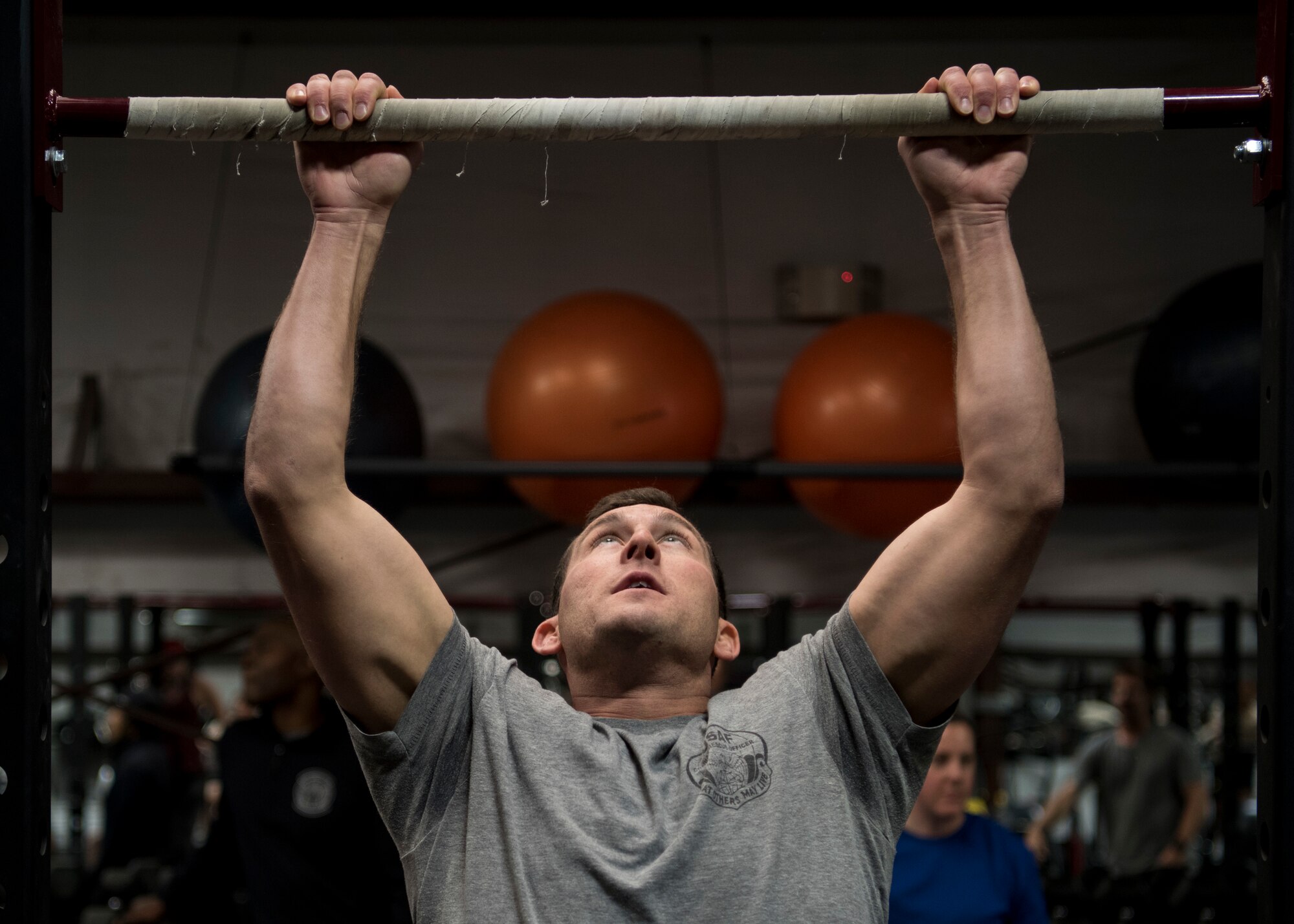 A participant in the Maltz Challenge performs a pull-up at Kirtland Air Force Base, N.M., March 9, 2018. More than 200 members of Kirtland AFB participated in the challenge. (U.S. Air Force photo by Staff Sgt. J.D. Strong II)