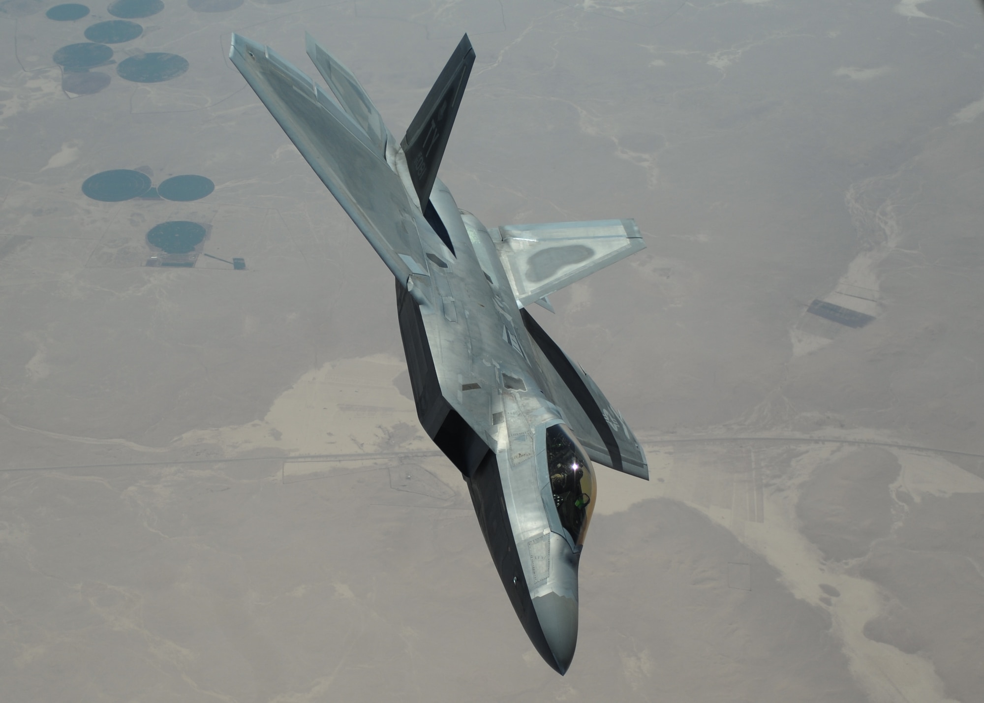 An F-22 Raptor from the 95th Expeditionary Fighter Squadron, Al Dhafra Air Base, United Arab Emirates, flies over Syria March 5, 2018. The F-22, a critical component of the Global Strike Task Force, is designed to project air dominance rapidly and at great distances, and defeat threats attempting to deny access to the Air Force, Army, Navy and Marine Corps. (U.S. Air National Guard photo by Staff Sgt. Colton Elliott)