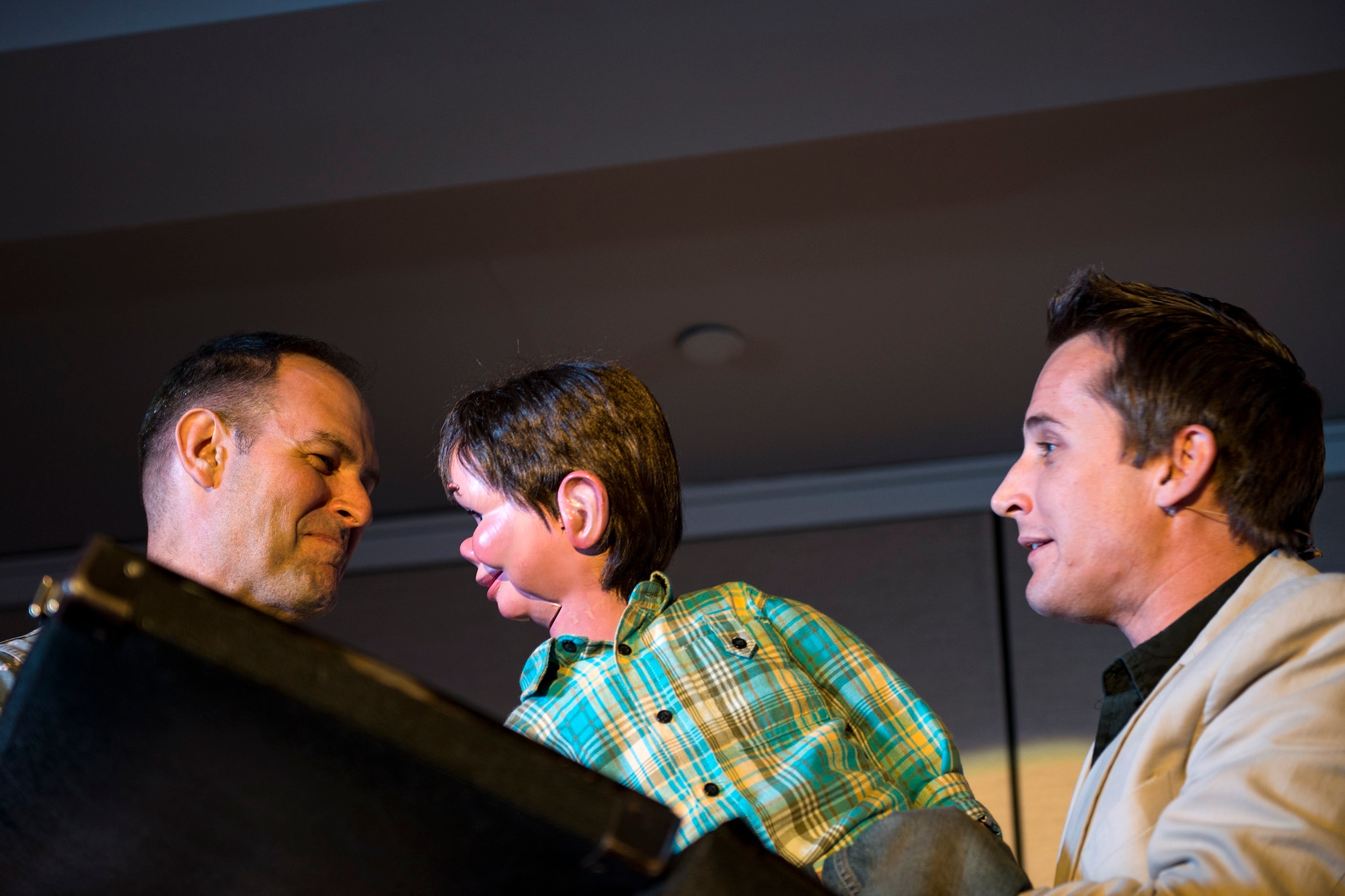 Ryan Bomgardner, right, ventriloquist, involves Col. Jay Vieatas, 23d Medical Group commander, in a skit with ‘Jeffrey’ during his comedy show, March 15, 2018, at Moody Air Force Base, Ga. Air Force Entertainment provided this opportunity for Airmen to attend as a family to enjoy some time away from the mission. Bomgardner is a full-time ventriloquist and comedian who performs over 140 shows annually throughout North America. (U.S. Air Force photo by Airman 1st Class Erick Requadt)