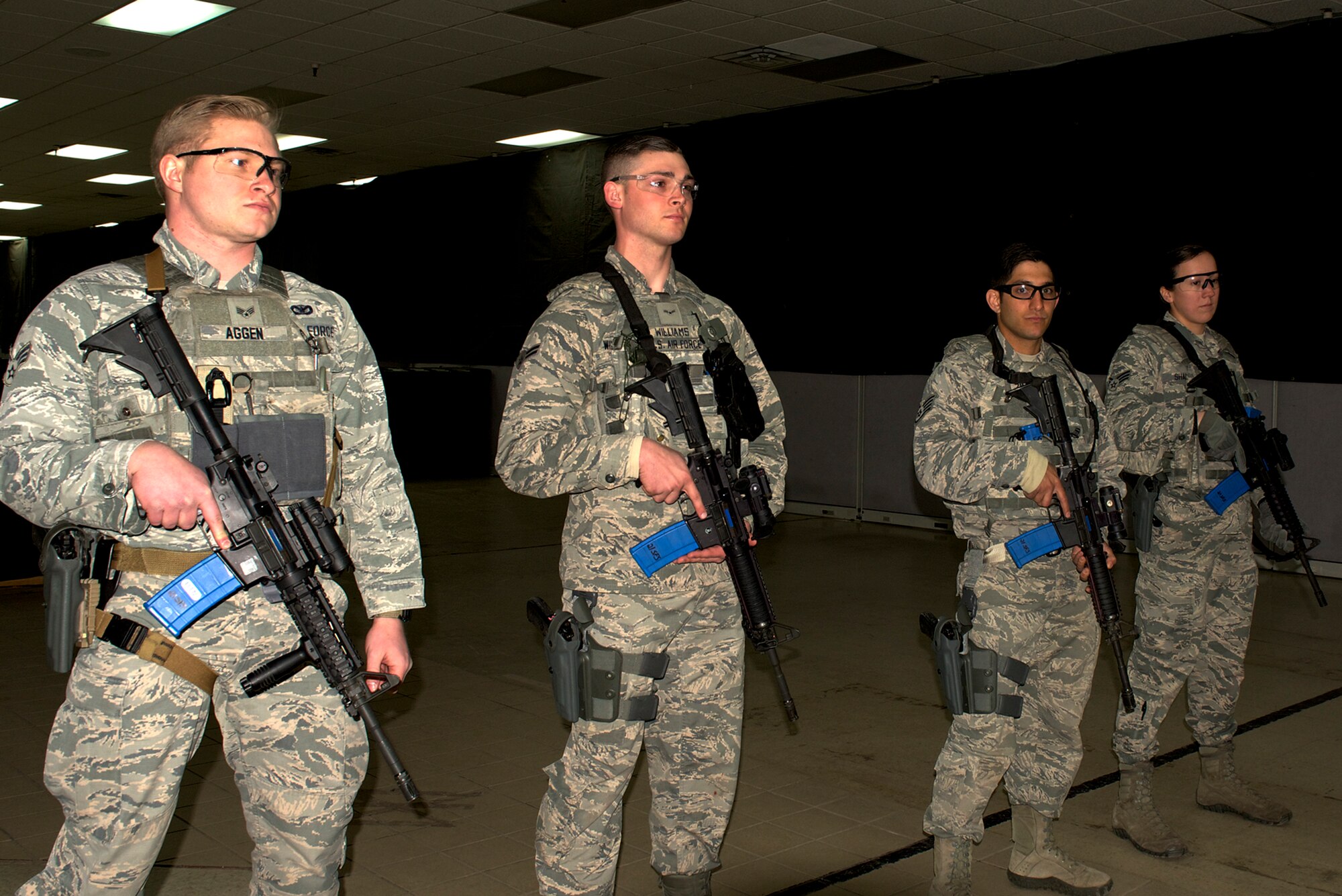 PETERSON AIR FORCE BASE, Colo. – Defenders prepare to give a demonstration at the 21st Security Forces Squadron Training Center at Peterson Air Force Base Colo., March 14, 2018. Maj. Gen. Stephen Whiting, 14th Air Force commander was greeted by 21 SFS Airmen during a visit here. (U.S. Air Force photo by Cameron Hunt)