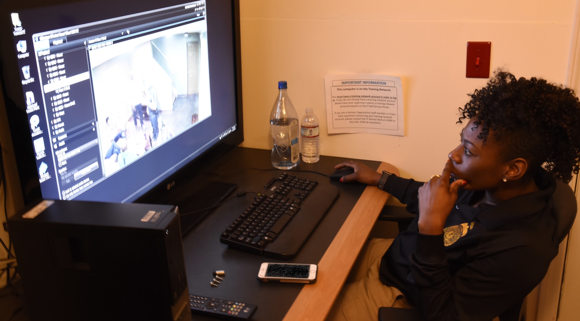 AFSIA Instructor, SA Tamisha Turner, monitors a simulated scenario which will be used by AFOSI SA students during their Cognitive Interviewing Course at the Federal Law Enforcement Training Center, Glynco, Ga. (U.S. Air Force photo by Wayne Amann, AFOSI/PA)