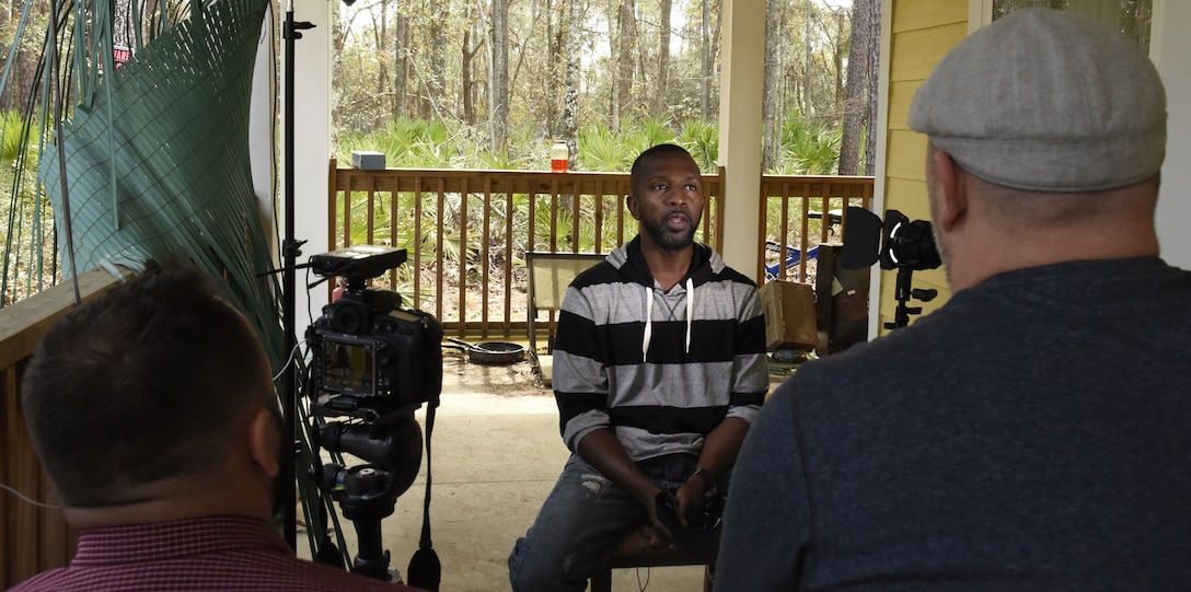 An Airman Magazine crew interviews Mr. Herbert Simmons, about his experience as a role player in a simulated scenario for the AFOSI Innovative Cognitive Interviewing Course, designed to enhance the quality and quantity of information recalled by victims, witnesses, subjects and sources. Simmons is a three-year veteran contractor hired by the Federal Law Enforcement Training Center at Glynco, Ga., who assists in making realistic scenarios for trainees. (U.S. Air Force photo by Wayne Amann, AFOSI/PA)