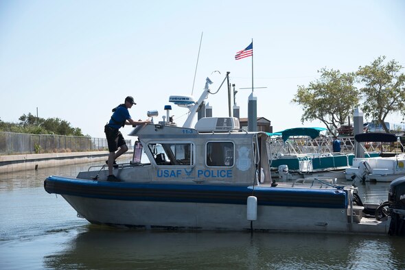 U.S. Air Force Marine Patrol crewmembers assigned to the 6th Security Forces Squadron, prepare to conduct a patrol of the waters around MacDill Air Force Base, Fla., March 5, 2018. Marine Patrol ensures the safety of the 7.2 mile coastline by running the perimeter 24 hours a day, seven days a week. (U.S. Air Force photo by Airman 1st Class Ashley Perdue)