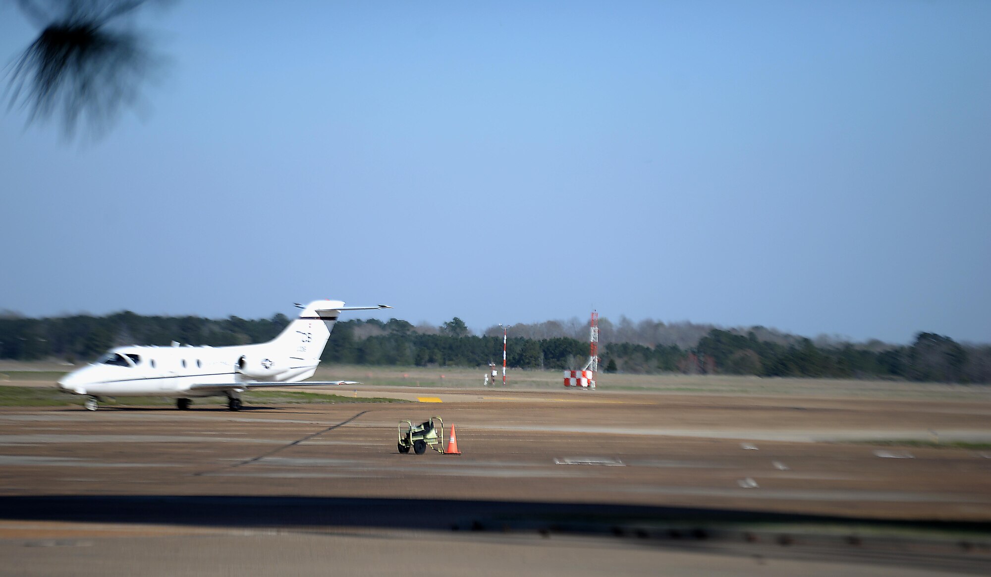 A T-1 Jayhawk taxies past the FMQ-19 system March 15, 2018, on Columbus Air Force Base, Mississippi. The system helps weather gauge the amount of rainfall has occurred to better inform pilots and commanders with critical weather analysis to get any task in front of them accomplished safely and effectively. (U.S. Air Force photo by Airman 1st Class Keith Holcomb)