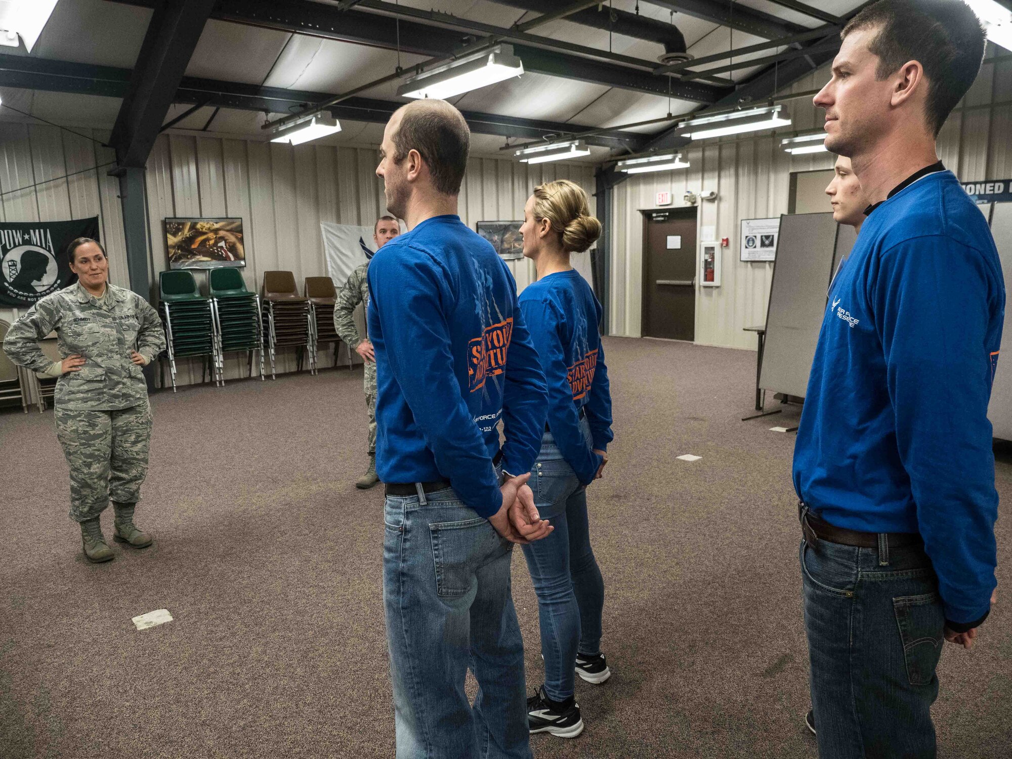 Master Sgt. Jana Schmidt, 934th Airlift Wing recruiter, calls out facing movements to trainees Chase Schmidt, Sara Syverhus, Jeffrey Metcalf and Robin Moore. (Air Force Photo/Paul Zadach)