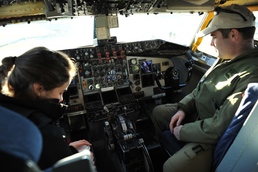 Two Canadian Royal Air Force pilots check out the KC-135 cockpit at the Girls Fly Too event March 11-12, at Abbotsford International Airport, Abbotsford, British Columbia, Canada. In addition to the KC-135 display from McConnell, there were also numerous displays from the Canadian air force and navy, including the elite Snowbirds and more.