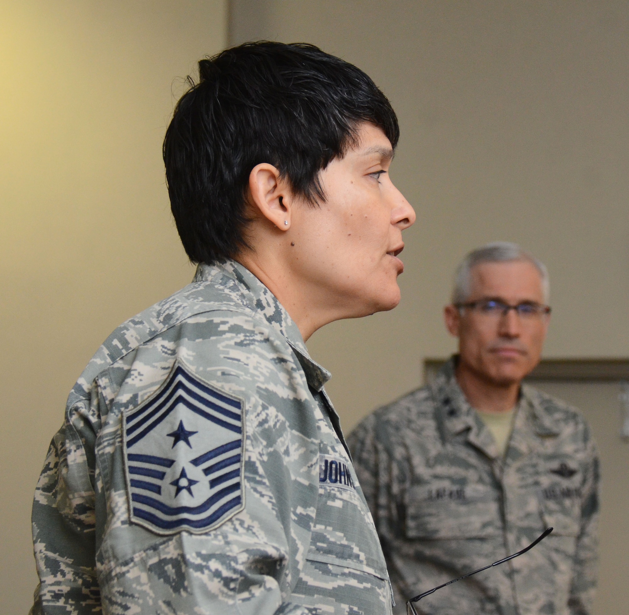 Twenty-Second Air Force Command Chief Imelda Johnson addresses the 22nd Air Force Senior Leader Summit attendees as 22nd Air Force Commander Maj. Gen. Craig La Fave looks on March 15, 2018 at Dobbins Air Reserve Base, Georgia.