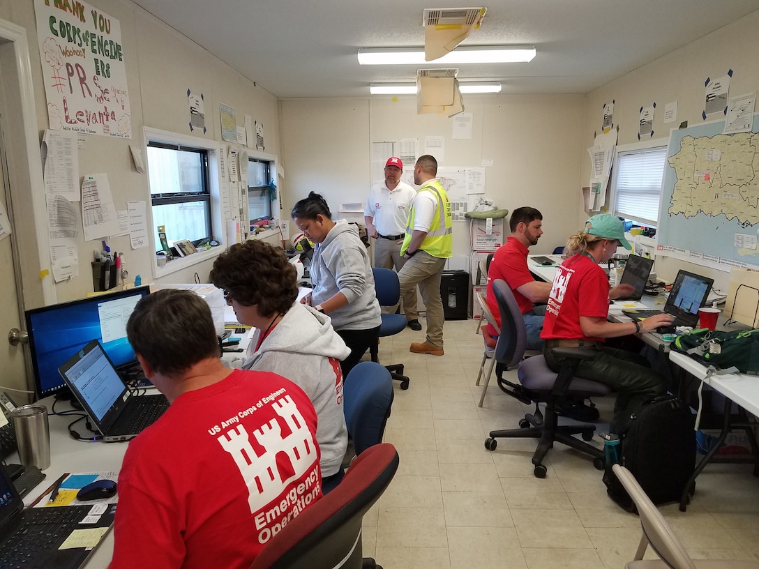 (From left to right) Bruce Hayes (SWT), Elizabeth Kelley (SWF), Susan Newby (NWS), Brian Choate (Mission Manager Lead), Richard Rendon (Mission Manager Night Shift), Asher Alexander (Mission Manager Day Shift), and Lauren Graves (MVM) conduct daily emergency operations.