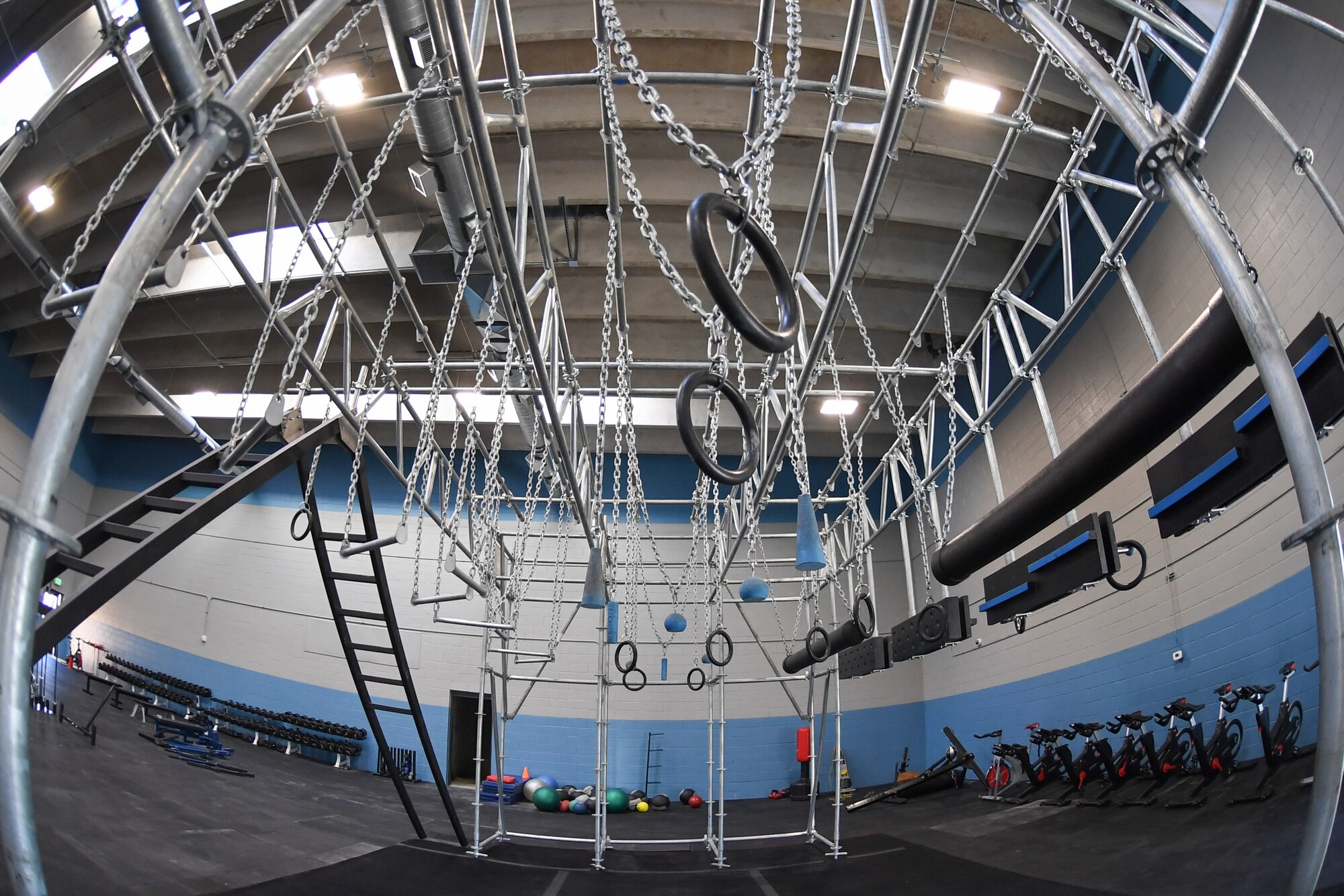 The functional training room previously located in a special area called The Bubble is now located inside the Hess Fitness Center. A ribbon cutting ceremony will be held on March 27 at 11 a.m. The new area houses rowing machines, spin bikes,TRX suspension training equipment, an Alpha Warrior obstacle course, weights, and other CrossFit equipment. (U.S. Air Force photo by Cynthia Griggs)