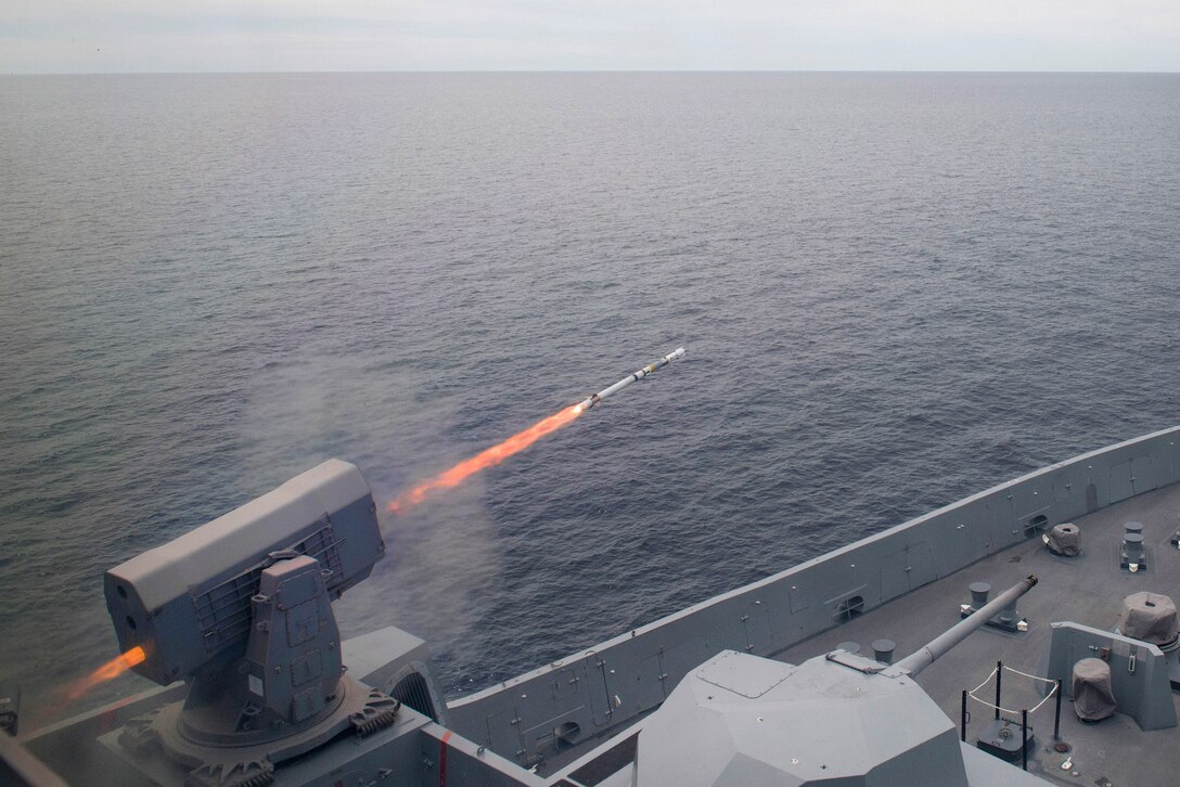 USS Anchorage fires a surface-to-air RIM-116 Rolling Airframe Missile.