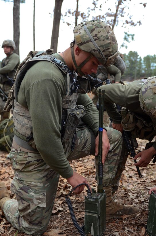 Soldiers operate a radio to demonstrate their communications proficiency.