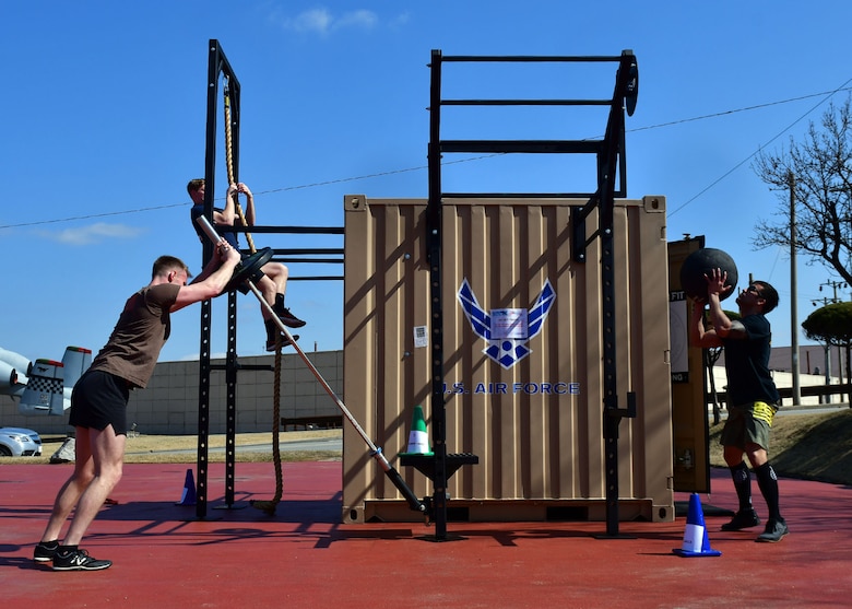 Members from the 51st Civil Engineer Squadron Explosive Ordnance Disposal (EOD) shop conducted a physical training session on the base fitness center tactical pad, Osan Air Base, Republic of Korea, March 16, 2018. The fitness center received two tactical training lockers and set up a course for the 51st EOD to test out the new equipment. (U.S. Air Force photo by Staff Sgt. Franklin R. Ramos)