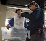Lisa Walters, left, a military spouse at Misawa Air Base, checks out a disaster kit pamphlet by Glen Chavez, right, an American Red Cross facilities operations specialist, at the American Red Cross booth at Misawa Air Base, Japan, March 16, 2018.  The emergency training and safety kits provided at the workshop contributes to the goal of keeping Team Misawa families safe during a natural disaster. (U.S. Air Force photo by Airman 1st Class Collette Brooks)
