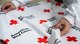 Karen Jorgenson, the American Red Cross of Misawa regional program manager, sets up the build your own emergency disaster kit booth at Misawa Air Base, Japan, March 16, 2018. This annual event provides individuals the opportunity to build their own starter preparedness kit used in the event of a natural disaster. (U.S. Air Force photo by Airman 1st Class Collette Brooks)