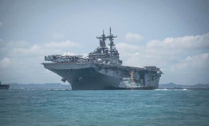 180319-N-YG104-0028 OKINAWA, Japan (March 19, 2018) The amphibious assault ship USS Wasp (LHD 1) departs the harbor at White Beach Naval Facility. Wasp with embarked 31st Marine Expeditionary Unit, is operating in the Indo-Pacific region as part of a regularly scheduled patrol and provides a rapid-response capability in the event of a regional contingency or natural disaster. (U.S. Navy photo by Mass Communication Specialist 2nd Class Sarah Villegas/ Released)