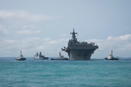 180319-N-YG104-0028 OKINAWA, Japan (March 19, 2018) The amphibious assault ship USS Wasp (LHD 1) departs the harbor at White Beach Naval Facility. Wasp, with embarked 31st Marine Expeditionary Unit, is operating in the Indo-Pacific region as part of a regularly scheduled patrol and provides a rapid-response capability in the event of a regional contingency or natural disaster. (U.S. Navy photo by Mass Communication Specialist 2nd Class Sarah Villegas/ Released)