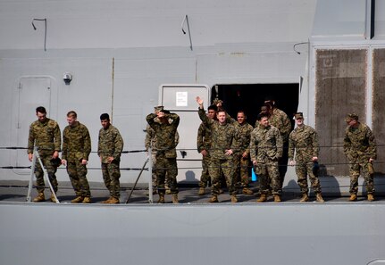 180319-N-RI884-0025 OKINAWA, Japan (March 19, 2018) Marines aboard the amphibious transport dock ship USS Green Bay (LPD 20) observe boat operations as the ship departs Okinawa. Green Bay, part of the Wasp Expeditionary Strike Group, with embarked 31st Marine Expeditionary Unit, is operating in the Indo-Pacific region to enhance operability with partners, serve as a ready-response force for any type of contingency and advance the Up-Gunned ESG concept.