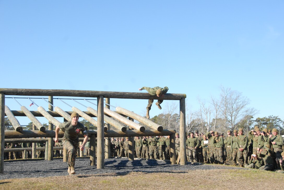On March 15, 2018 Marine Corps Engineer School (MCES) hosted the annual St. Patrick’s Day Engineer Field Meet to pay homage to St. Patrick, the patron saint for engineers; build camaraderie amongst the engineer and utility communities, and compete for the Engineer Field Meet Trophy. Teams of Marines compete in the Obstacle Course Relay to see who can run all their Marines through the Obstacle Course the fastest.