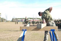On March 15, 2018 Marine Corps Engineer School (MCES) hosted the annual St. Patrick’s Day Engineer Field Meet to pay homage to St. Patrick, the patron saint for engineers; build camaraderie amongst the engineer and utility communities, and compete for the Engineer Field Meet Trophy. To complete a turn in the Cross Cut Relay, Marines sprint down Ellis Field to saw horses where they must use a crosscut saw to cut the end off of a piece of wood.
