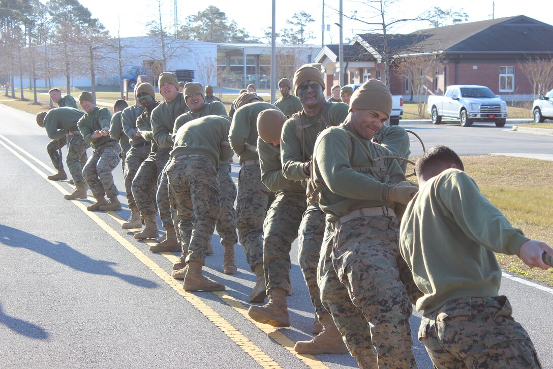 On March 15, 2018 Marine Corps Engineer School (MCES) hosted the annual St. Patrick’s Day Engineer Field Meet to pay homage to St. Patrick, the patron saint for engineers; build camaraderie amongst the engineer and utility communities, and compete for the Engineer Field Meet Trophy.  This year there were five units that competed in Marine, engineer, and utility themed events:  MCES, Marine Wing Support Squadron-274 (MWSS-274), Combat Logistics Battalion-2 (CLB-2), 8th Engineer Support Battalion (8th ESB), and 2d Combat Engineer Battalion (2d CEB). Here a team of Marines pull a Backhoe Loader (BHL) approximately 100 meters. The BHL weighs roughly 21,000 pounds.