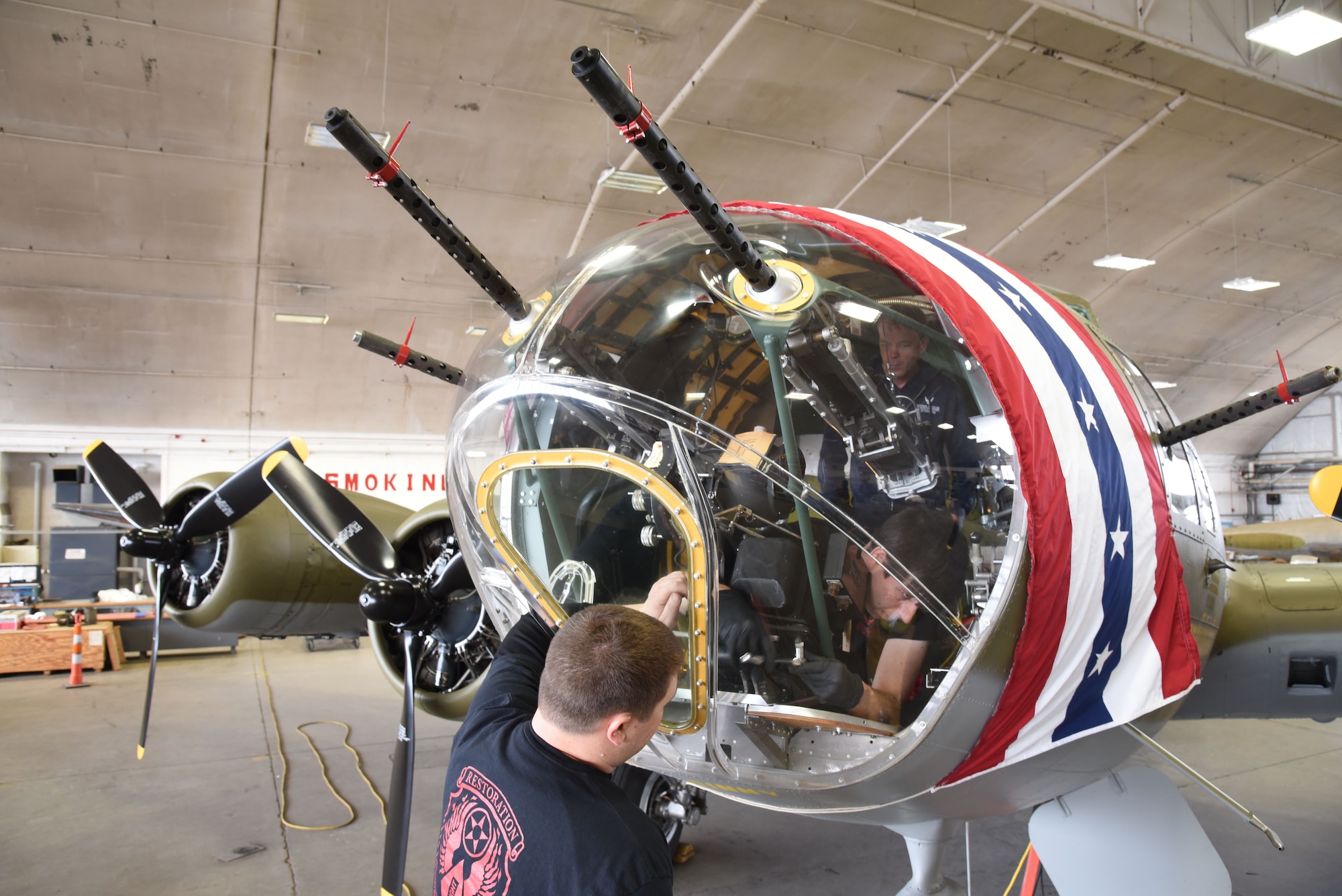 (03/09/2018) -- Museum restoration specialists Nick Almeter and Casey Simmons install a bomb sight in the Boeing B-17F Memphis Belle. Plans call for the aircraft to be placed on permanent public display in the WWII Gallery here at the National Museum of the U.S. Air Force on May 17, 2018. (U.S. Air Force photo by Ken LaRock)