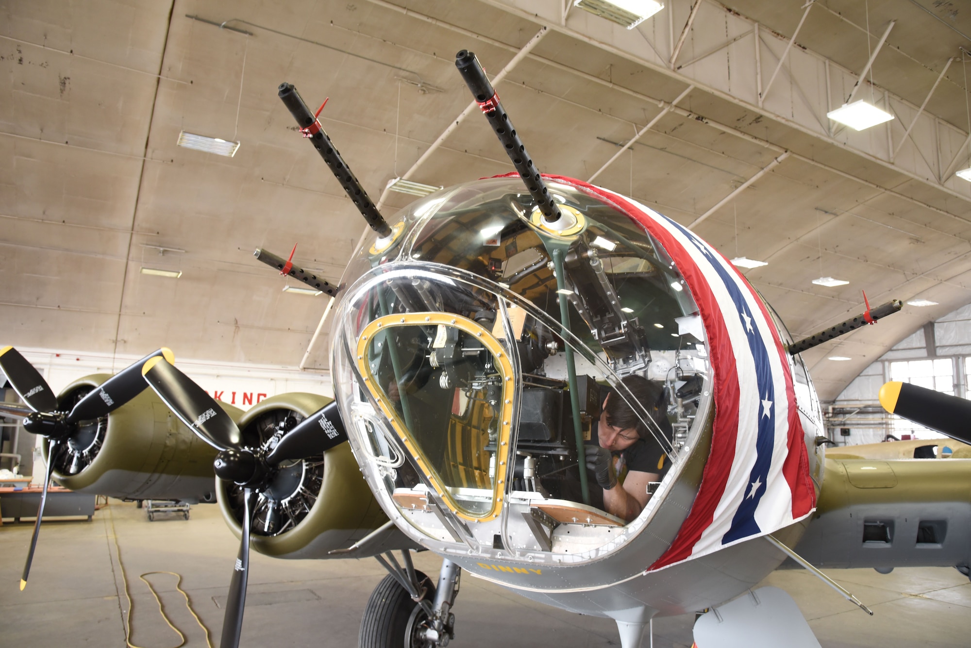 (03/09/2018) -- Museum restoration specialist Casey Simmons installs a bomb sight in the Boeing B-17F Memphis Belle. Plans call for the aircraft to be placed on permanent public display in the WWII Gallery here at the National Museum of the U.S. Air Force on May 17, 2018. (U.S. Air Force photo by Ken LaRock)