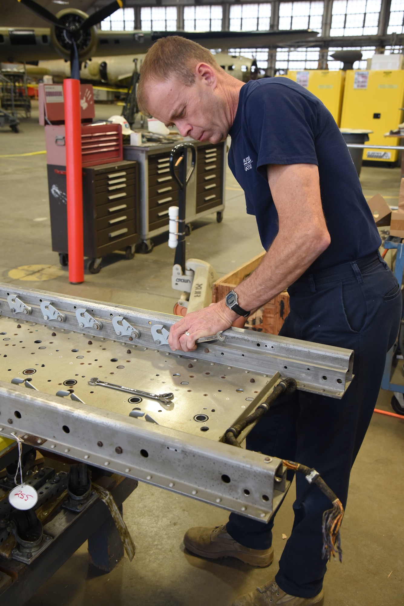 (02/22/2018) -- Museum restoration specialist Brian Lindamood works on the bomb racks for the Boeing B-17F Memphis Belle. Plans call for the aircraft to be placed on permanent public display in the WWII Gallery here at the National Museum of the U.S. Air Force on May 17, 2018. (U.S. Air Force photo by Ken LaRock)