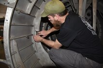 (02/26/2018) -- Museum restoration specialist Chad Vanhook attaches a data plate to the Boeing B-17F Memphis Belle. Plans call for the aircraft to be placed on permanent public display in the WWII Gallery here at the National Museum of the U.S. Air Force on May 17, 2018. (U.S. Air Force photo by Ken LaRock)