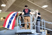 (02/26/2018) -- Museum restoration specialists Casey Simmons, Roger Brigner and Chad Vanhook attach the nose cone onto the Boeing B-17F Memphis Belle. Plans call for the aircraft to be placed on permanent public display in the WWII Gallery here at the National Museum of the U.S. Air Force on May 17, 2018. (U.S. Air Force photo by Ken LaRock)