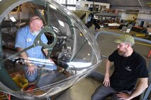(02/26/2018) -- Museum restoration specialists Roger Brigner and Chad Vanhook work on the bomb sight mount in the Boeing B-17F Memphis Belle. Plans call for the aircraft to be placed on permanent public display in the WWII Gallery here at the National Museum of the U.S. Air Force on May 17, 2018. (U.S. Air Force photo by Ken LaRock)