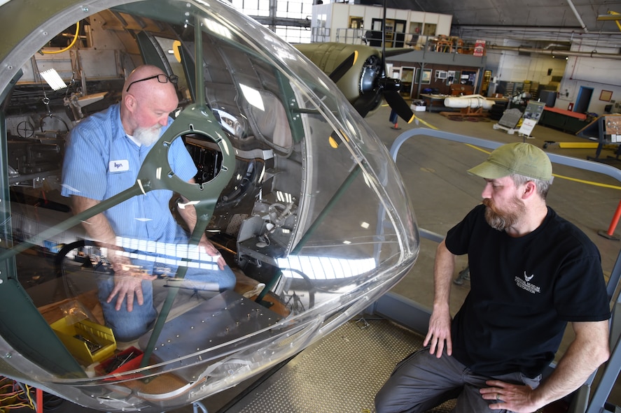 (02/26/2018) -- Museum restoration specialists Roger Brigner and Chad Vanhook work on the bomb sight mount in the Boeing B-17F Memphis Belle. Plans call for the aircraft to be placed on permanent public display in the WWII Gallery here at the National Museum of the U.S. Air Force on May 17, 2018. (U.S. Air Force photo by Ken LaRock)