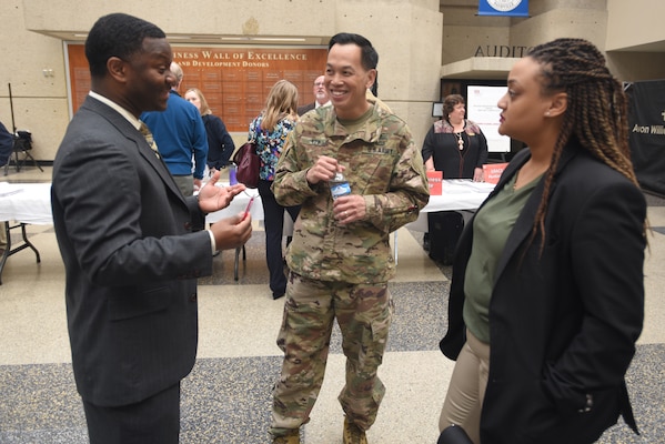 Brig. Gen. Mark Toy, U.S. Army Corps of Engineers Great Lakes and Ohio River Division commander, meets with Christopher Ballard, vice president of operations for Simms Building Group, and Endia Javon, administrative assistant and project administrator for Simms Building Group, during the Business Opportunities Open House, also known as "BOOH," at Tennessee State University in Nashville, Tenn., March 15, 2018. (USACE photo by Lee Roberts)