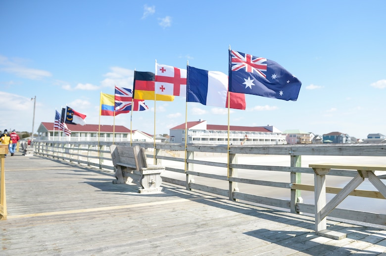 Flags of the six guest nations participating in the 2018 Marine Corps Trials are flown at Ocean Crest Pier in Oak Island, N.C., March 14, 2018, during the USO of North Carolina’s “American Experience Day.” The Marine Corps Trials promotes recovery and rehabilitation through adaptive sport participation and develops camaraderie among recovering service members and veterans. It is as an opportunity for RSMs to demonstrate their achievements and serves as the primary venue to select Marine Corps participants for the DoD Warrior Games.
