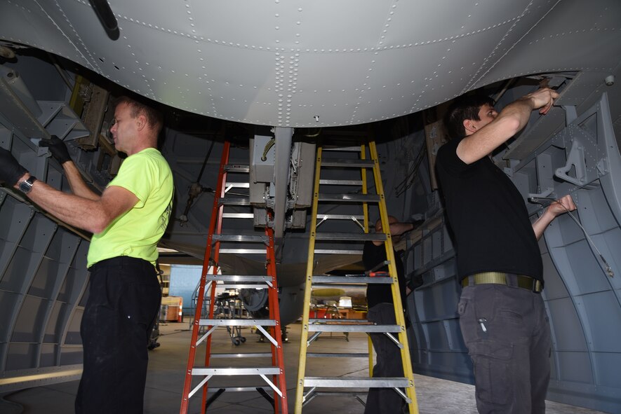 (03/06/2018) -- Museum restoration crews attach bomb bay doors of the Boeing B-17F Memphis Belle. Plans call for the aircraft to be placed on permanent public display in the WWII Gallery here at the National Museum of the U.S. Air Force on May 17, 2018. (U.S. Air Force photo by Ken LaRock)