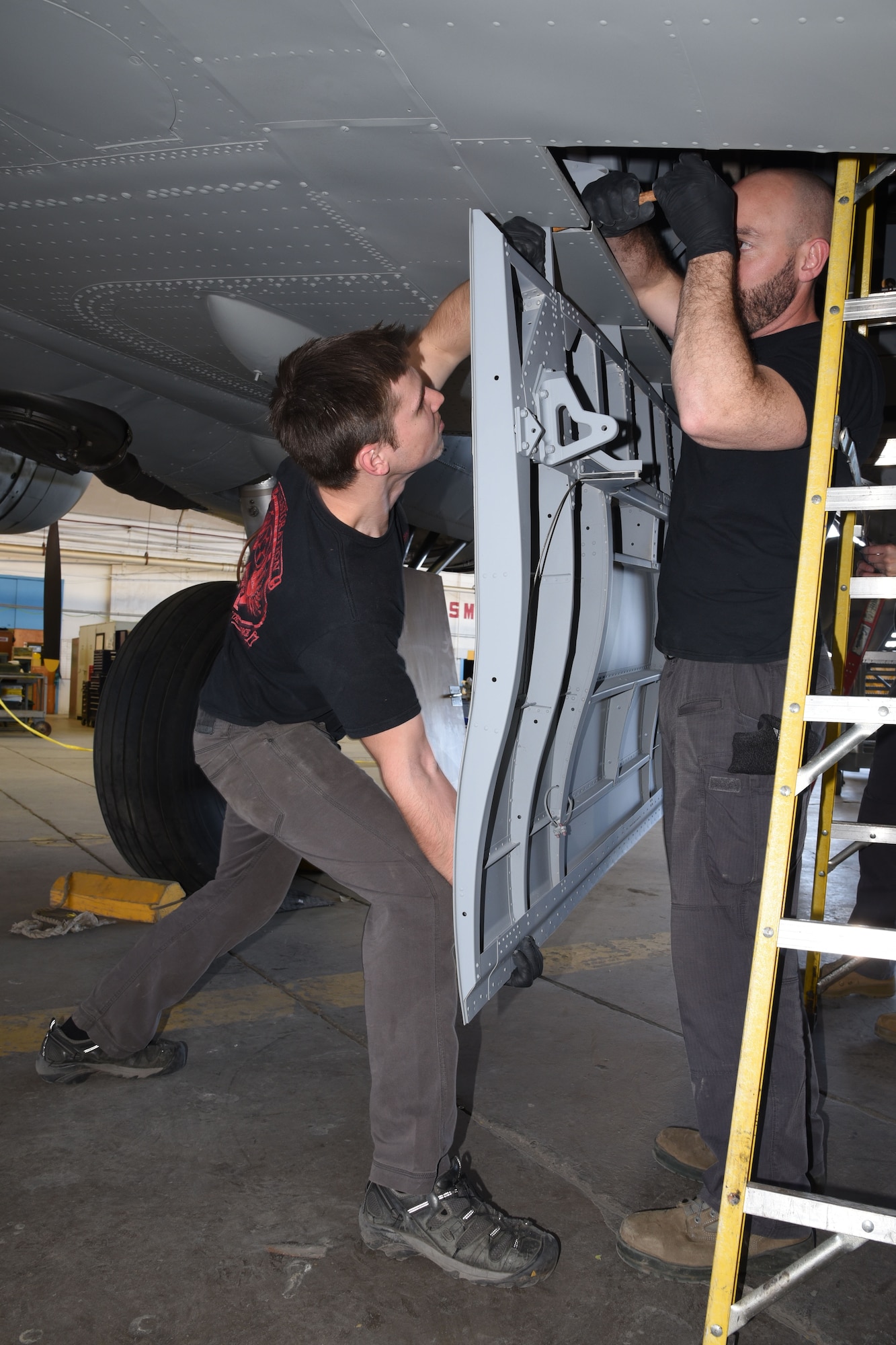 (03/06/2018) -- Museum restoration specialists Jason Davis and Chase Meredith attach bomb bay doors of the Boeing B-17F Memphis Belle. Plans call for the aircraft to be placed on permanent public display in the WWII Gallery here at the National Museum of the U.S. Air Force on May 17, 2018. (U.S. Air Force photo by Ken LaRock)