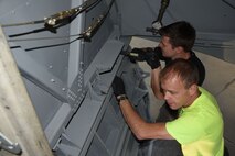 (03/06/2018) -- Museum restoration specialists Brian Lindamood and Jason Davis attach bomb bay doors of the Boeing B-17F Memphis Belle. Plans call for the aircraft to be placed on permanent public display in the WWII Gallery here at the National Museum of the U.S. Air Force on May 17, 2018. (U.S. Air Force photo by Ken LaRock)
